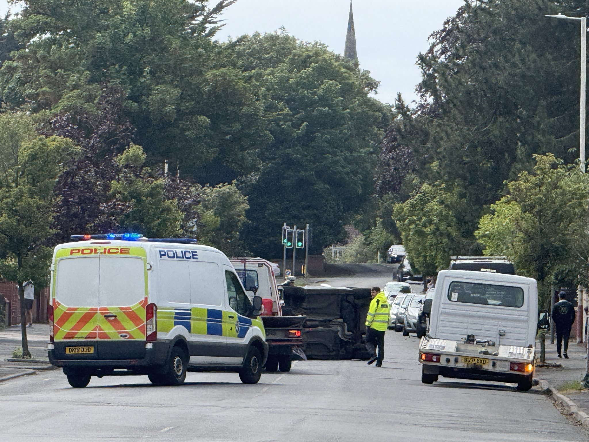 Busy road partially closed after car flips over | OTS News - Southport